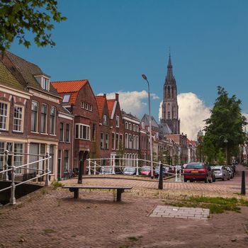 Street with canal in old town of Delft in sommer time, Holland