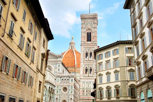 Street of Florence with view on cupola of Duomo cathedral