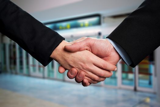 Business handshake after signing new contract