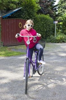 young girl with her bicycle