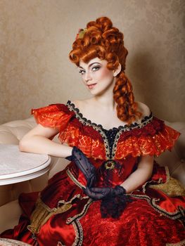 Attractive girl red dress and red wig courtesan