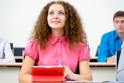 image of a young female student in the classroom, teaching at the University of