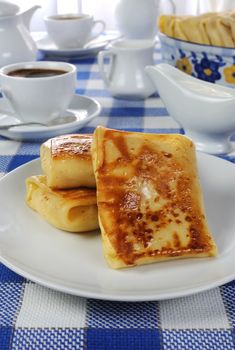  Spring rolls and a cup of coffee on the table