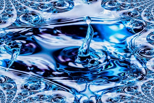 A beautiful shape created by the fluid motion of water splashing as it is poured.