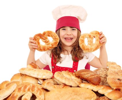 happy little girl cook hold pretzels