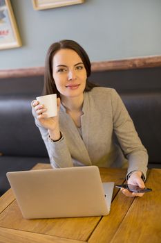 female businesswoman laptop restaurant