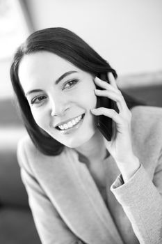 smiling female businesswoman mobile phone restaurant