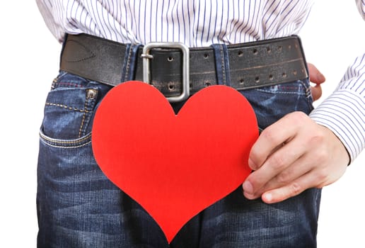 Person holds Red Heart Shape near the Jeans closeup Isolated on the White Background