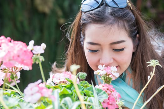 A portrait of beautiful asian woman with flower