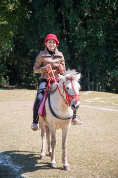 Asia women on horseback