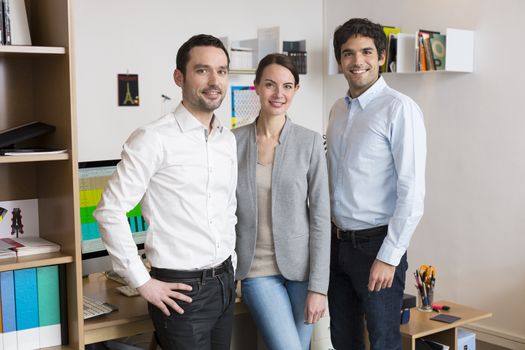 Female male desk colleagues group looking camera