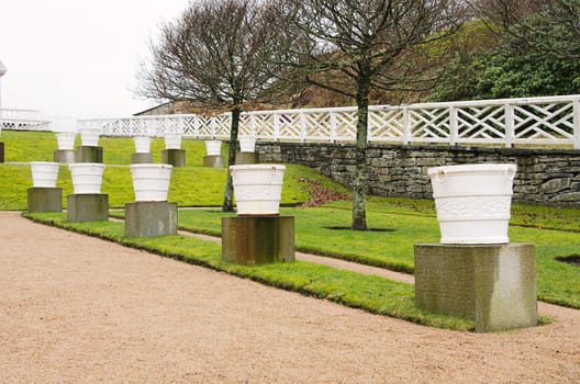 a row of beautiful garden pots that are not planted