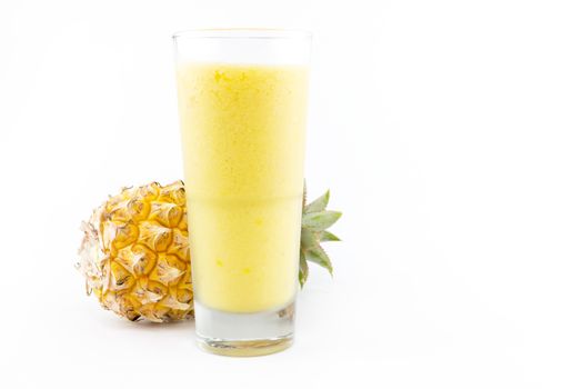 pineapple smoothie with fresh pineapple on white background
