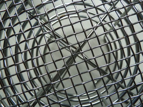 Bright silver metal mesh with crossed metal pieces
