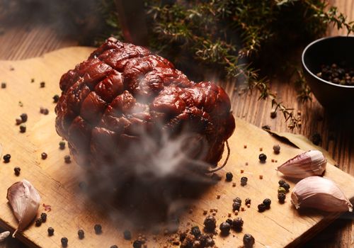 Homemade ham on wooden background