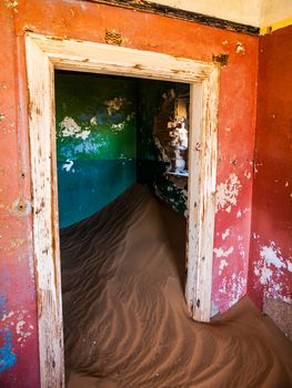 Sand in abandoned house in Kolmanskop ghost town (Namibia)