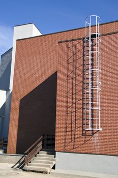 industrial building wall with metal ladder