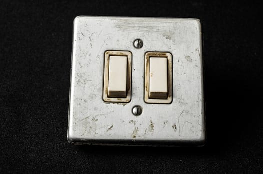 Light switch, old-style on a Black Background