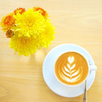 Cup of latte or cappuccino coffee with flower                        