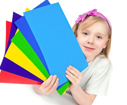 beautiful girl with a pink Hoop on the head holds colored paper