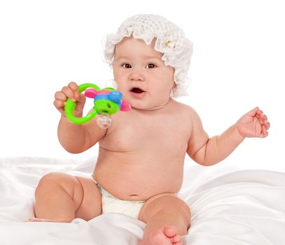 Baby playing with a toy isolated on white