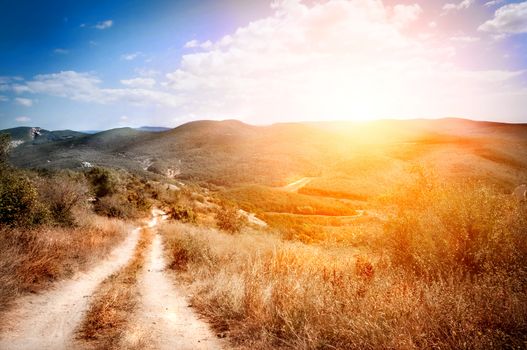 landscape with Country road against sunset