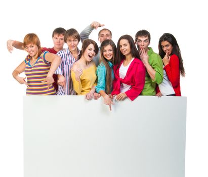 Happy young group of people standing together and holding a blank sign for your text. isolated on white background