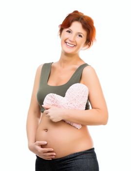 Beautiful pregnant woman holding a heart - isolated on white background