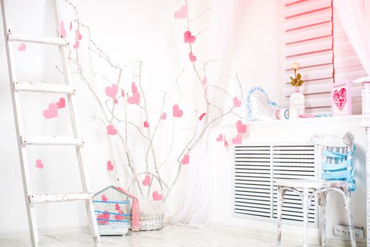 romantic Valentine's Day interior with pink hearts on у tree