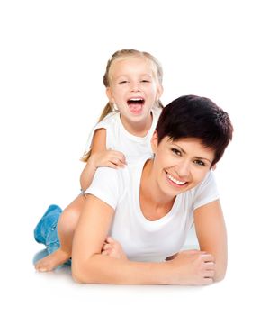 Mother and daughter laughing and looking at camera