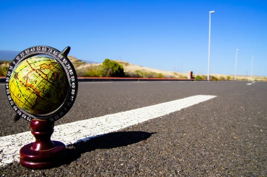 Conceptual Image Globe Earth on an Asphalt Street