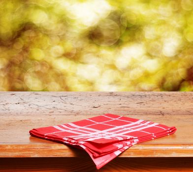 Empty wooden table and autumn background