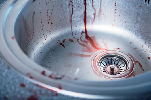 Close-up shot of bloody kitchen sink, Halloween or crime scene 