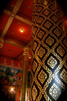 traditional gold painting at temple pillars,Thailand