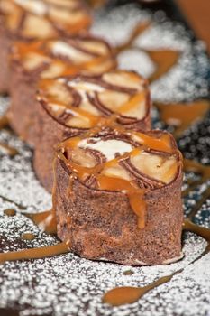 Chocolate roll with various caramel and cream