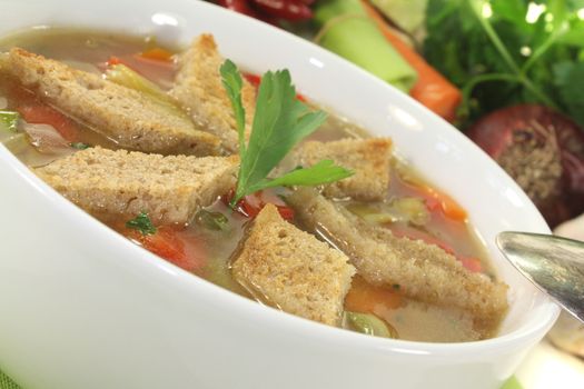 Bread Soup with parsley on a light background