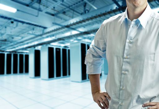 Server room with operating staff in white shirt