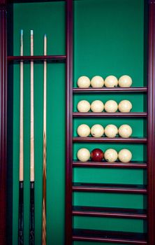 Billiard stand with cues and balls