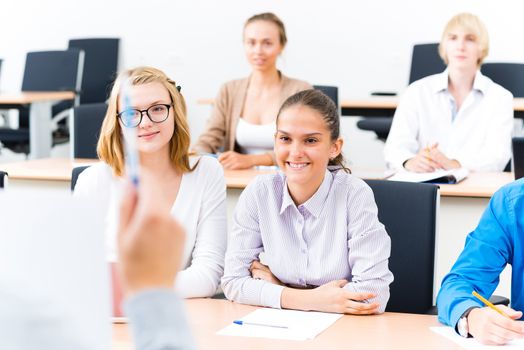 image of a students listen attentively to the teacher