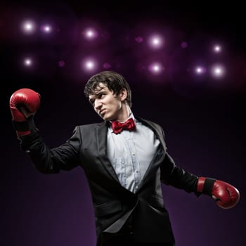 image of a businessman with boxing gloves in the ring, the competition in the business