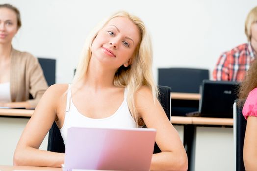 portrait of young female student in the classroom, teaching at the University of