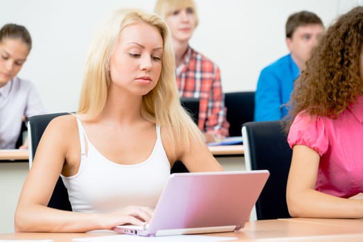 portrait of young female student in the classroom, teaching at the University of