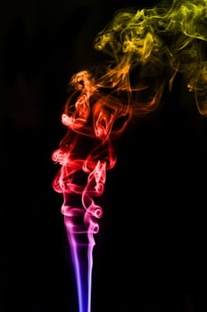 textured of colorful incense smoke on dark background