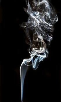 textured of incense smoke on dark background