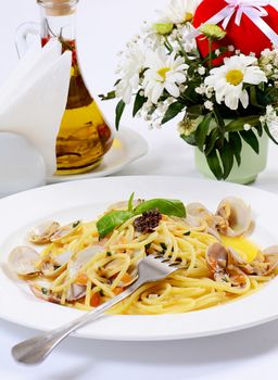 Spaghetti with mussels in bowls close up