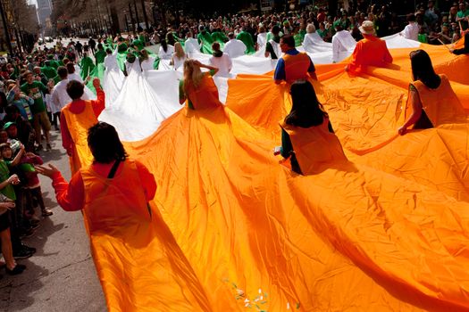 Atlanta, GA, USA - March 15, 2014:  People form a human flag of Ireland at the St. Patrick's parade on Peachtree Street.