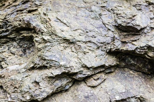 A natural wall of rough stone