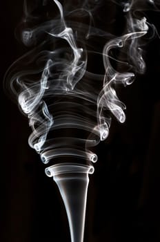 textured of incense smoke on dark background