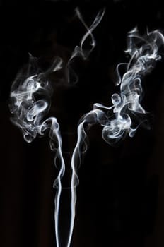 textured of incense smoke on dark background