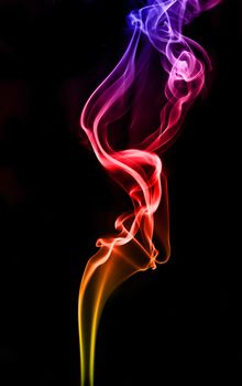 textured of colorful incense smoke on dark background